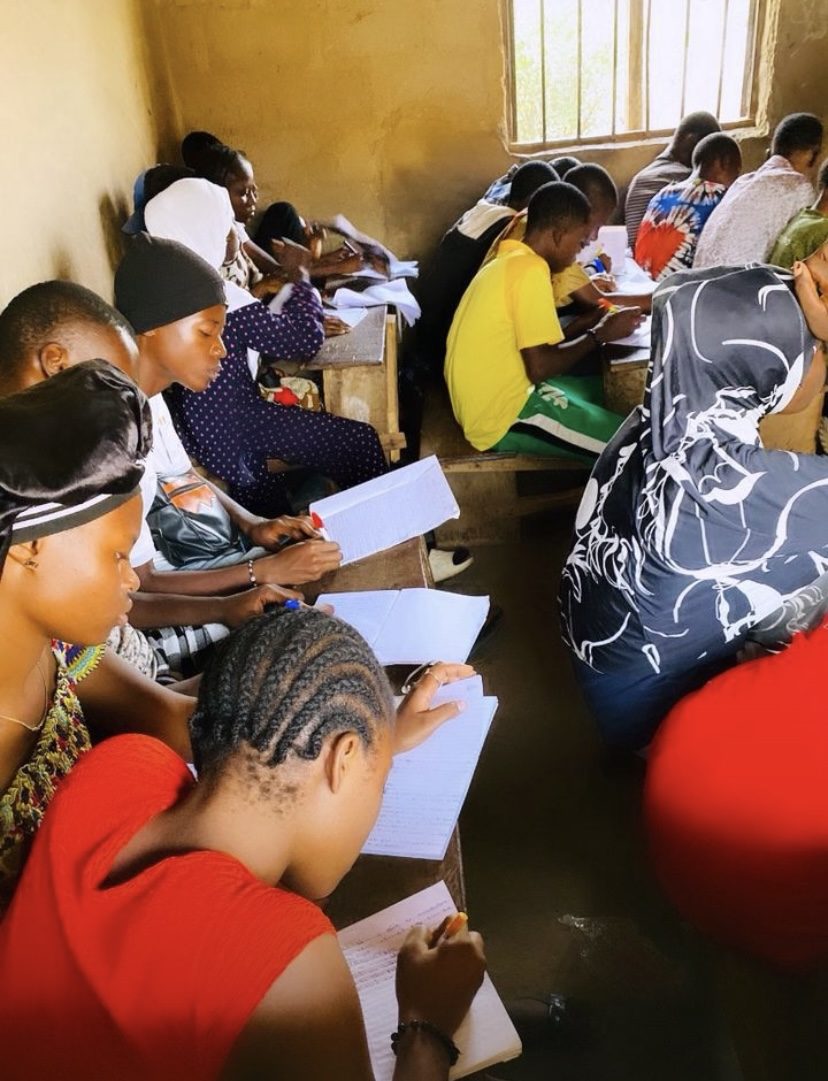 Students writing notes during a Best Graders Tutors class